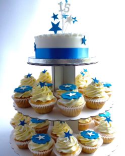 Cake with cupcakes on stand with star topper in blue