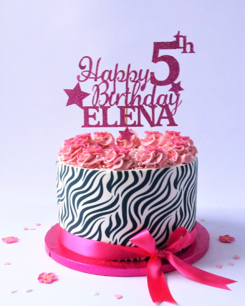 Zebra print birthday cake with topper