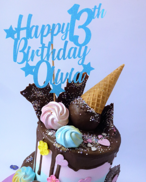 Blue cake topper on a ice cream cone birthday cake